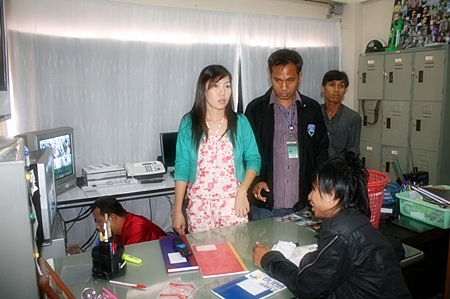 Police raid the upstairs betting salon above the Thip Fashion boutique in central Pattaya.